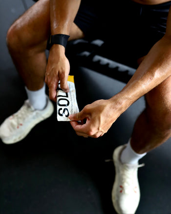 Man holding SOLO all-in-one supplement sachet in hands